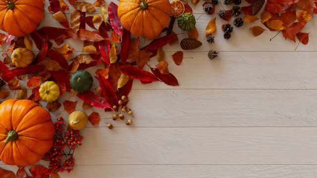 Top down view of White wood Tabletop with leaves, Pumpkins and Acorns.