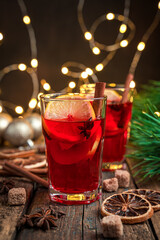 Mulled wine in the evening lighting on a festive background.