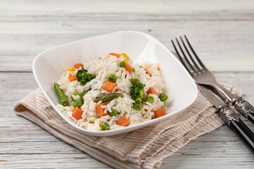Bowl with tasty rice and vegetables