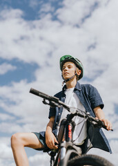 Fototapeta na wymiar Boy on a bike, summer hobby