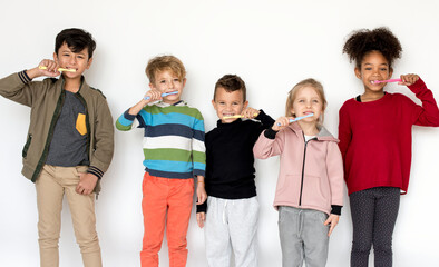 Kids brushing their teeth - Powered by Adobe
