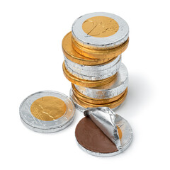 Heap of golden and silver chocolate coins for the celebration of Sint Nicolaas close up on white...