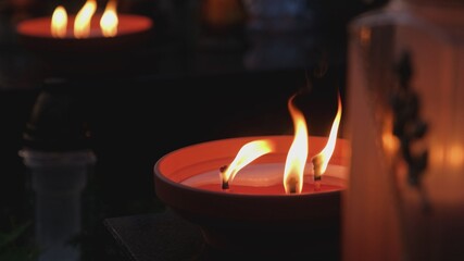 Ecofriendly Non Plastic Traditional Classic Clay Paraffin Wax Memorial Candles Burning on Cemetery on All Saints Day Evening