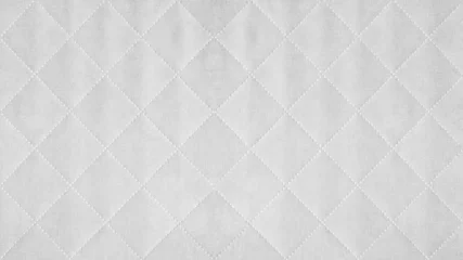 Fotobehang White colored seamless natural cotton linen textile fabric texture pattern, with diamond quilted, rhombic stiching.  stitched background © Corri Seizinger