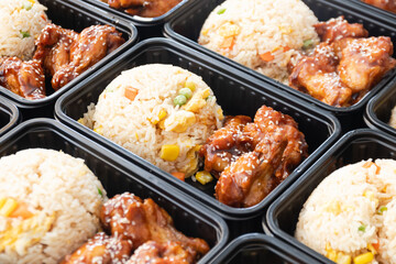 Japanese bento box, Japanese food lunch boxes in plastic packages. Fried rice with Teriyaki chicken.