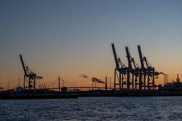 Köhlbrandbrücke with cranes of a container terminal in Hamburg in the evening