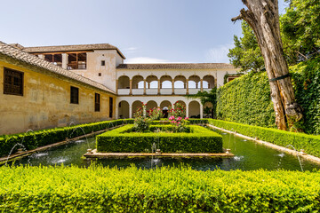 Fototapeta premium Generalife palace with green courtyard in Alhambra, Granada, Spain