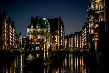 Naklejka na ściany i meble The illuminated Speicherstadt in Hamburg in the evening