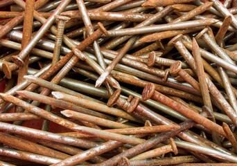 Rusty nails spilled on the worktop.
