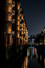 The illuminated Speicherstadt in Hamburg in the evening