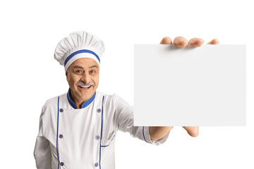 Cheerful mature male chef showing a blank card