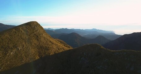 Aerial reveal shot of beautiful sunset at Mt Alexander, Seaward Kaikoura Range. Kaikoura.