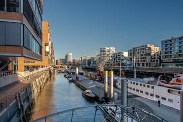 The Hafencity in Hamburg with the Sandtorhafen on a cludless day