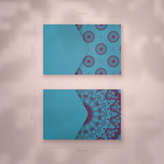 Business card in turquoise color with a luxurious purple pattern for your business.