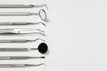 Professional Dentist tools on white background with copy space