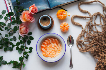 breakfast with a cup of coffee and some tangerines