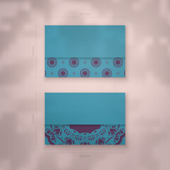 Business card template in turquoise color with a luxurious purple pattern for your business.