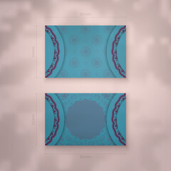 Business card template in turquoise color with Indian purple pattern for your contacts.