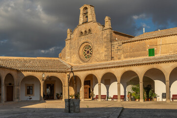 Fototapeta na wymiar Monti-sion Monastery at sunset. Main facade of the church. Island of Mallorca, Spain