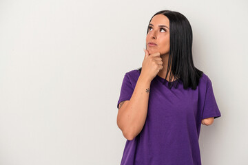 Young caucasian woman with one arm isolated on white background looking sideways with doubtful and skeptical expression.