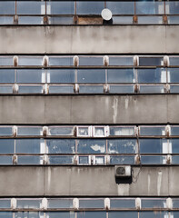Facade of old, concrete office building in sunny day