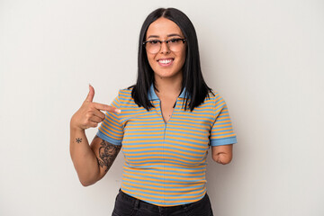 Young caucasian woman with one arm isolated on white background person pointing by hand to a shirt copy space, proud and confident