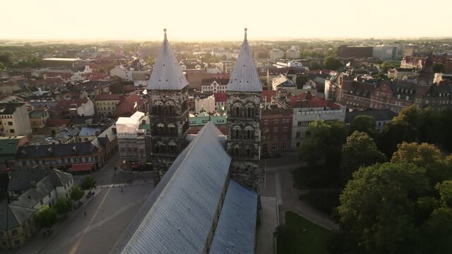 Drone flying fast over Lund Cathedral, Golden hour, Sweden