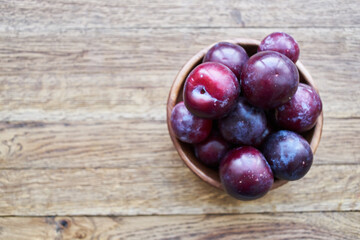 plums fruits natural products on a wooden table top view