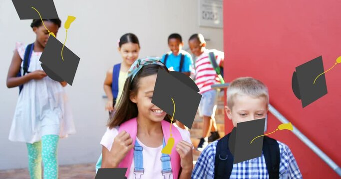 Animation of school graduation hat icons over smiling school children at school