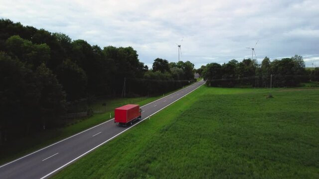 KAUNAS, LITHUANIA - Jul 04, 2021: An aerial view of the red truck on the road, Kaunas, Lithuania