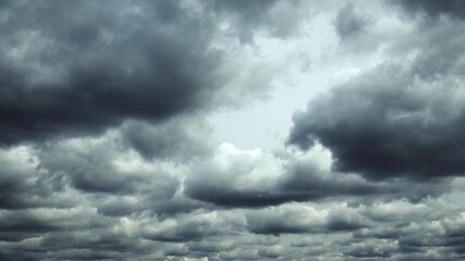 Obraz premium Heavy Dark Cloudy Sky With Fluffy Clouds. Natural Sky Background. Weather Forecast Concept