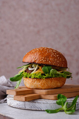 Cheeseburger with beef cutlet and vegetables