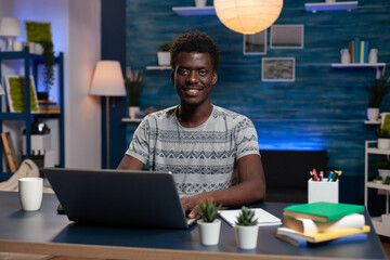 Man working from home office, browsing on laptop, typing using keyboards in business work computer online activity. Freelancer browsing management information on laptop computer working remote from © DC Studio