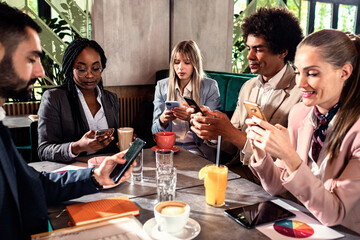 Group of business people having meeting in cafe.