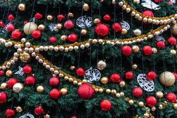 New Year's toys and decorations hang on the tree. Close-up. Christmas tree.
