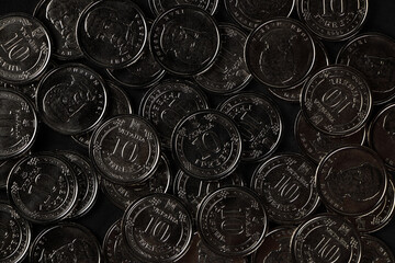 Ukrainian hryvnias coins. Background from Ukrainian coins 10 hryvnia. Money and finances.