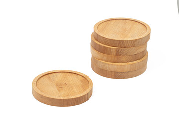 Round wooden coasters isolated above white background