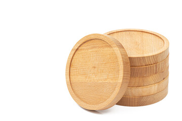 Round wooden coasters isolated above white background