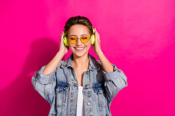 Photo of young cheerful happy attractive woman wear headphones smile sunglass isolated on pink color background