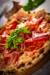 pizza with parma ham and arugula