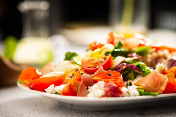 salad with tomato parma ham and cheese