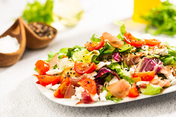 salad with tomato parma ham and cheese