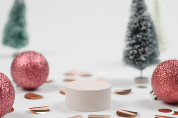 Christmas scene for showcasing cosmetic products. Podium with New Year's decor, with red balls and...