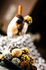 coconut cocoa and walnut balls in a wine glass