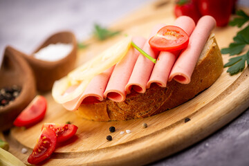 sandwich in traditional style on wooden plate