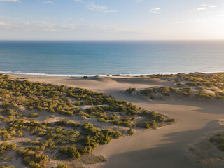 Landscape of the Dunes of Bani surrounded by the sea under the sunlight in the Dominican Republic
