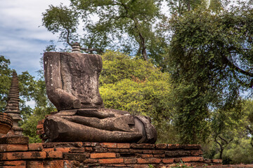 Aytthaya, Thailand, 22 Aug 2020 : Ancient old buddha statue sculpture is damaged at the old temple in Ayuthaya province, thailand. Selective focus.