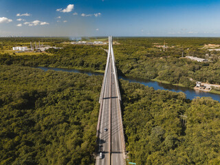Mauricio Baez Bridge surrounded by greenery on a sunny day in the Dominican Republic