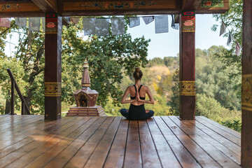 Obraz na płótnie Canvas young woman meditate at the park, yoga namaste