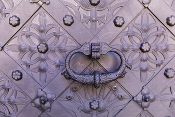 Old door with an interesting ornament, close-up.